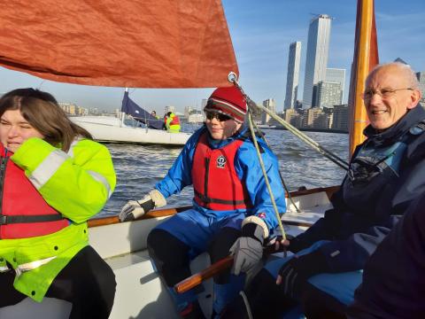 Participants gettgin hands on experience of sailing on the River Thames