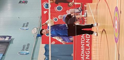 Talkback member playing badminton at 4 Nations Tournament