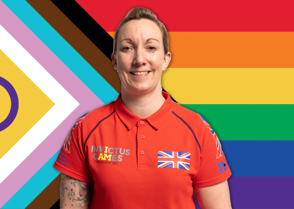 Stacey Denyer - Dressed in red Invictus Games polo shirt, looking at the camera and smiling. Superimposed over Progress Flag.